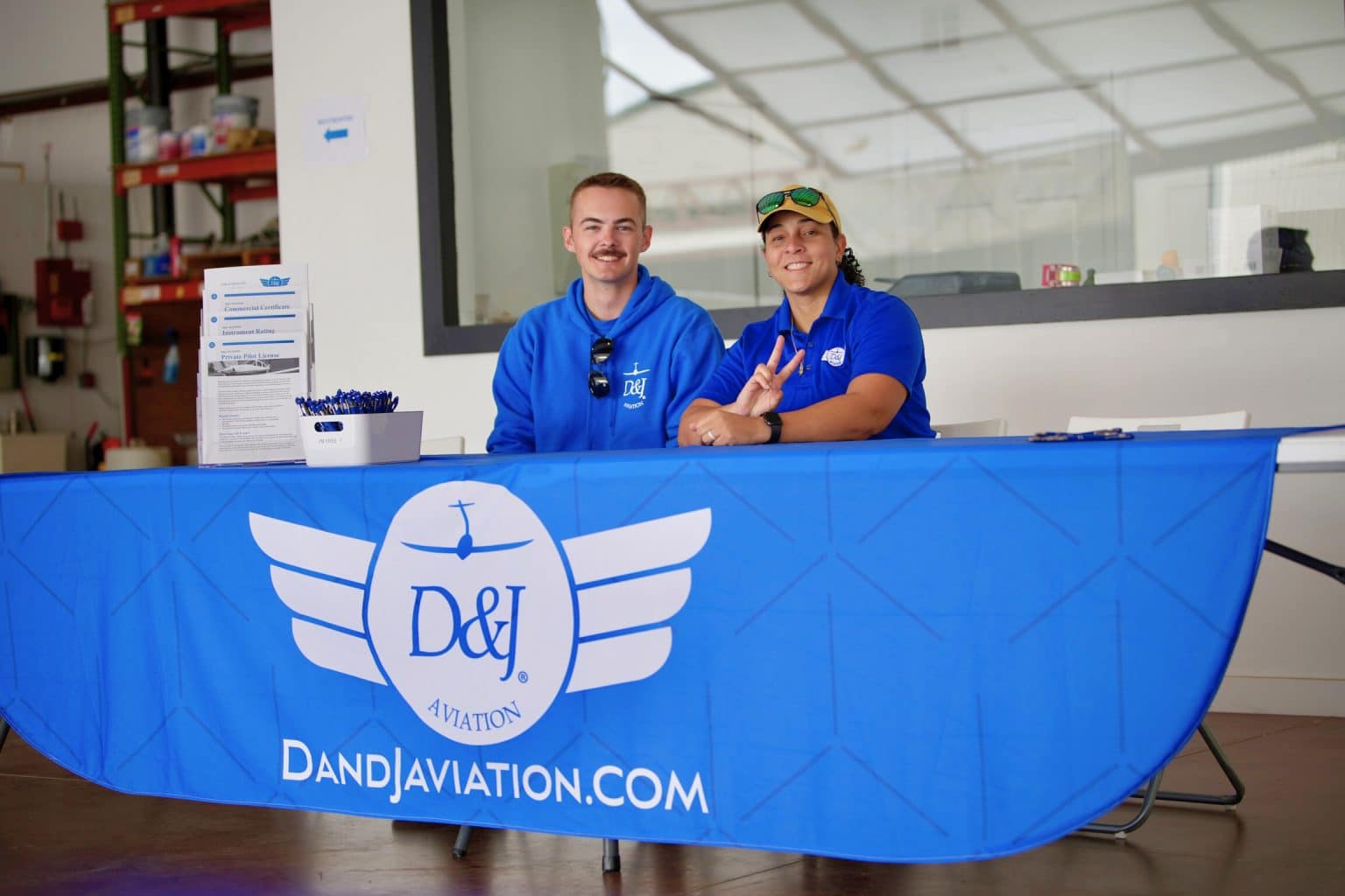 d & J aviation instructors with flag